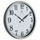 A round wall clock with a white face, black Arabic numerals, black hands, and a silver-toned outer frame. The center of the dial has a subtle gray floral pattern, and the brand name 'HERITAGE' is printed above the 12.