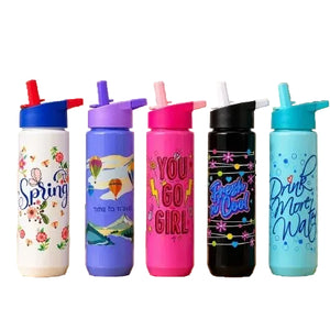 Five reusable flip-straw water bottles in different colors are lined up against a plain white background. The bottles are white, lavender, pink, black, and light blue, each decorated with colorful graphics and motivational text including 'Spring', 'GO GIRL', 'Fresh Fruit', and 'Drink More Water'.